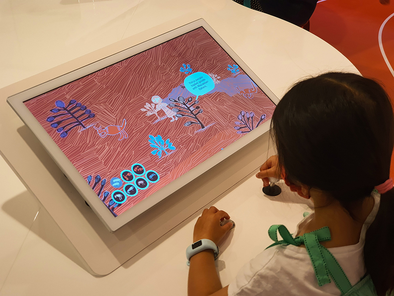 A girl playing the bird level from A Walk in the Bush.