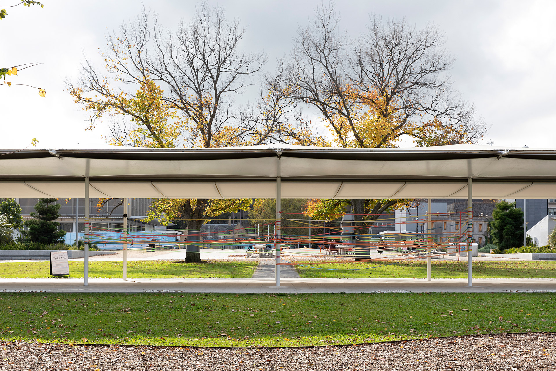 Wide shot of the south-facing side of the Transient Threads installation.