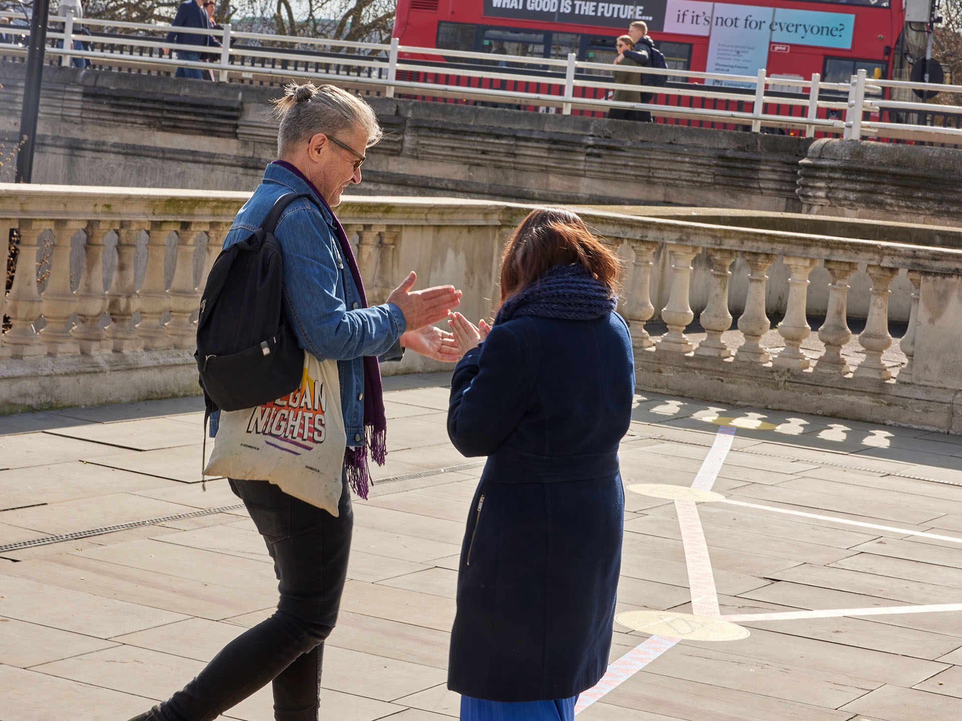Two players clapping together as part of the Rainbow Paths installation at Now Play This festival.