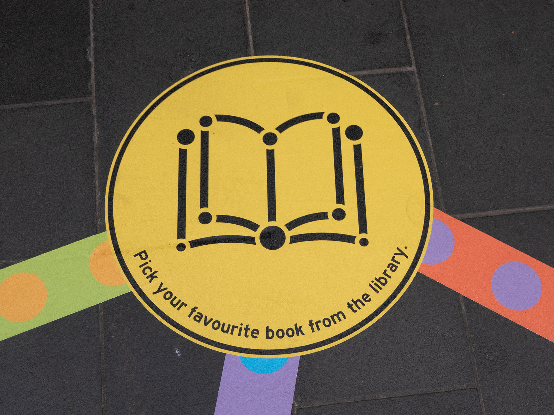 Close-up of the 'Favourite book' mini-game from the Rainbow Paths installation at a library pop-up.
