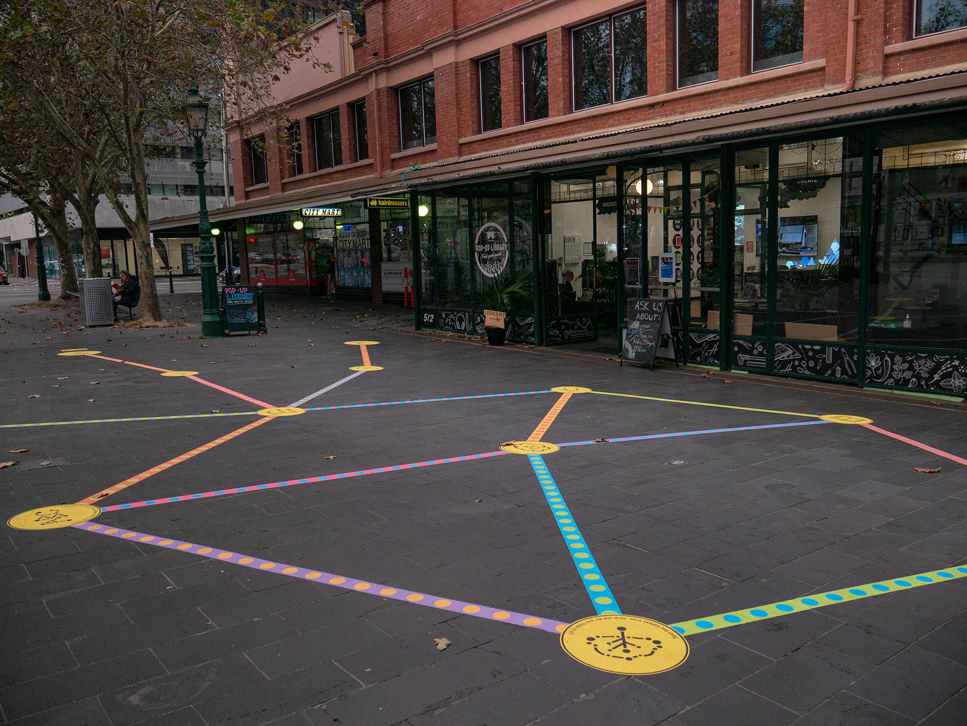 Wide shot of the Rainbow Paths installation at a pop-up library.