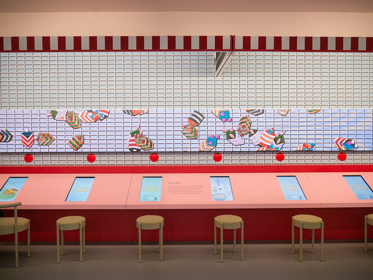 Wide shot and front-on view of the Stack a Snack exhibit.