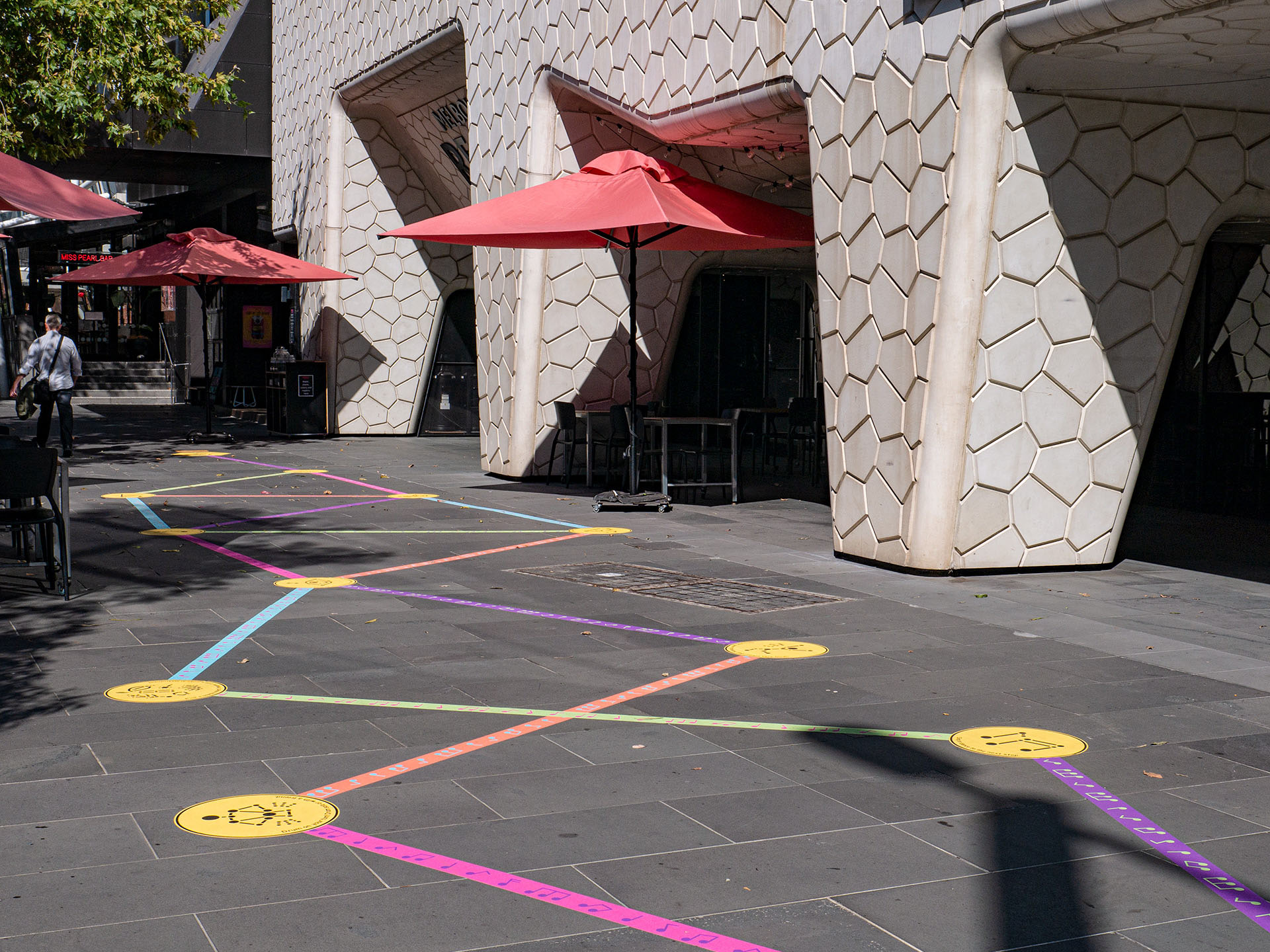 Wide shot of the Rainbow Paths installation across the entrance of the Melbourne Recital Centre.
