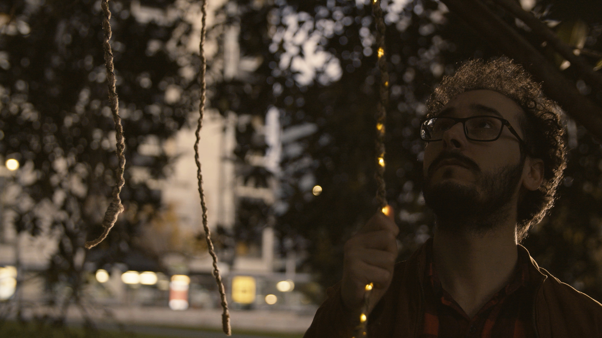 Player looking up at a Heartree rope sensor while it is lit up.