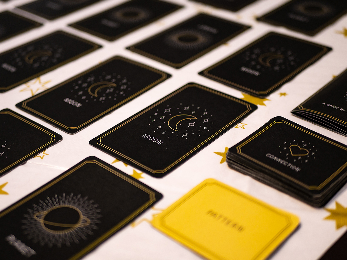 Moonscope cards laid out on a table at Feminine Play.