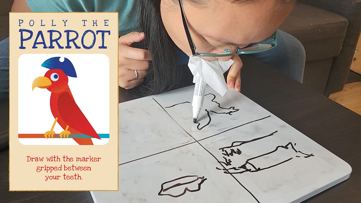 Player drawing with the marker in their mouth, while playing Pirate Doodle-Doo.