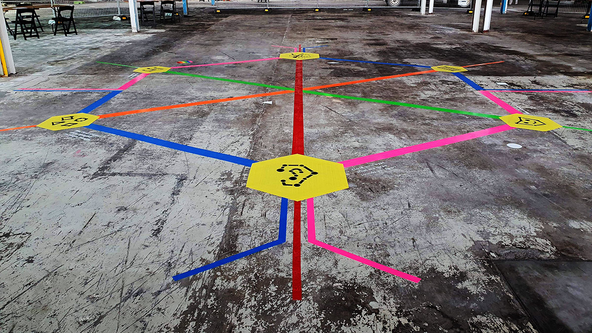 Wide shot of the Rainbow Paths installation in a Brunswick warehouse.