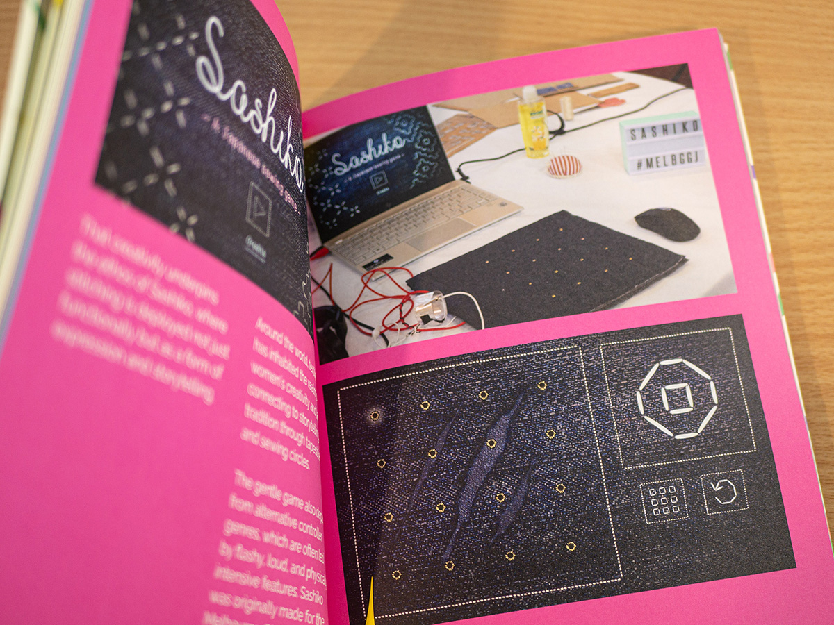 Sashiko pages within the Feminine Play exhibition catalogue.