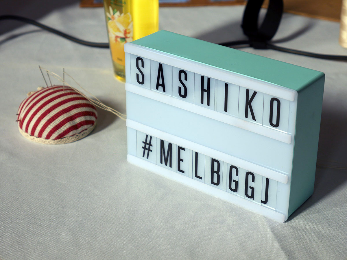 Lightbox display of Sashiko at the Play Party.