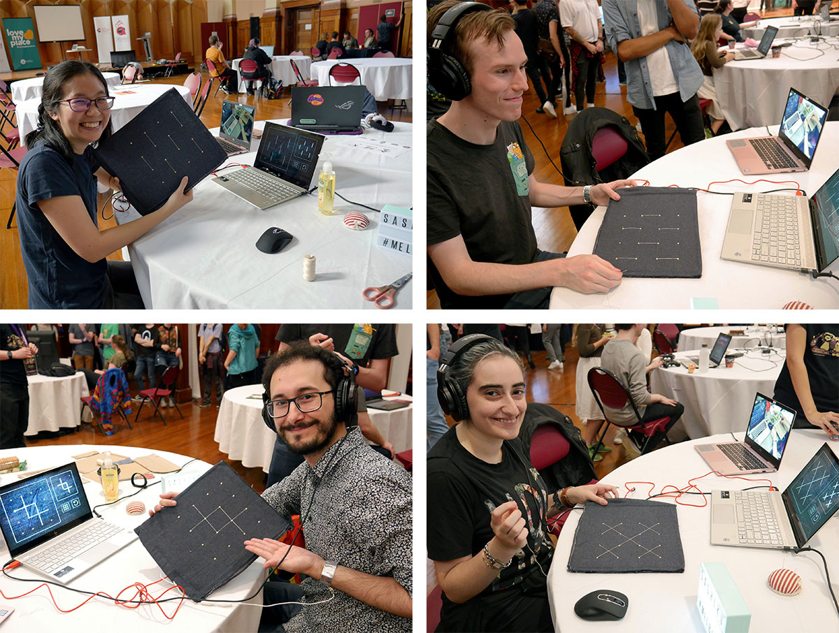 Players smiling while playing Sashiko at the Play Party.