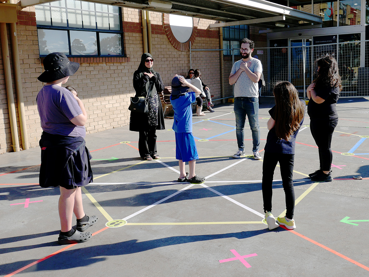 Players and facilitator playing a game together.