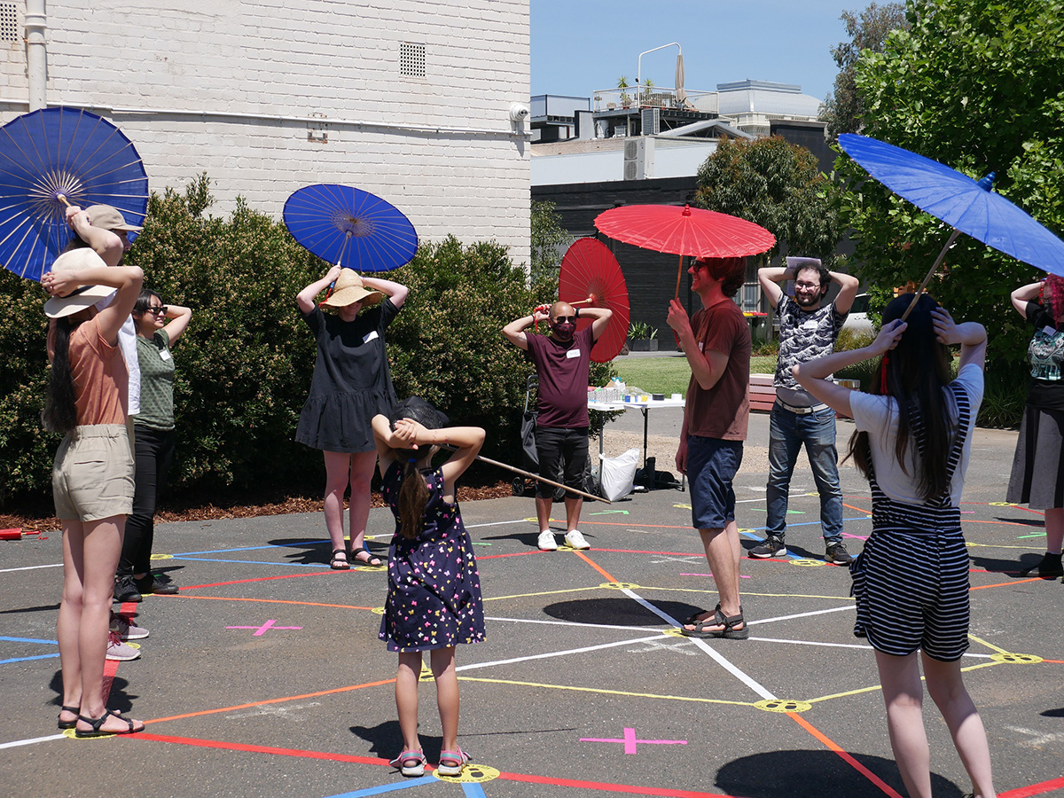 A group of players smiling at each other in the playspace.